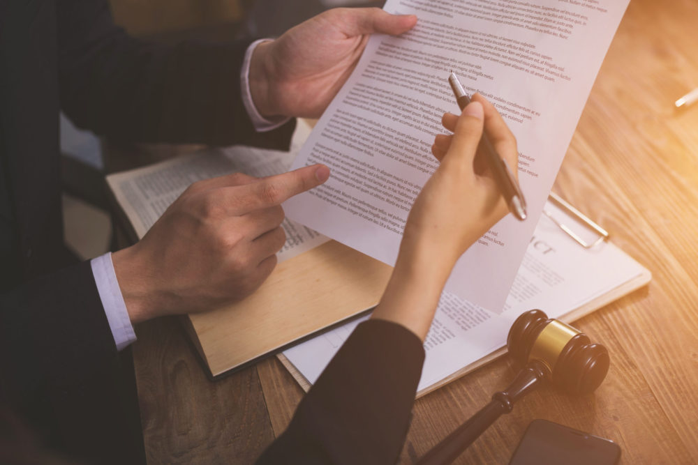 Lawyers reviewing documents