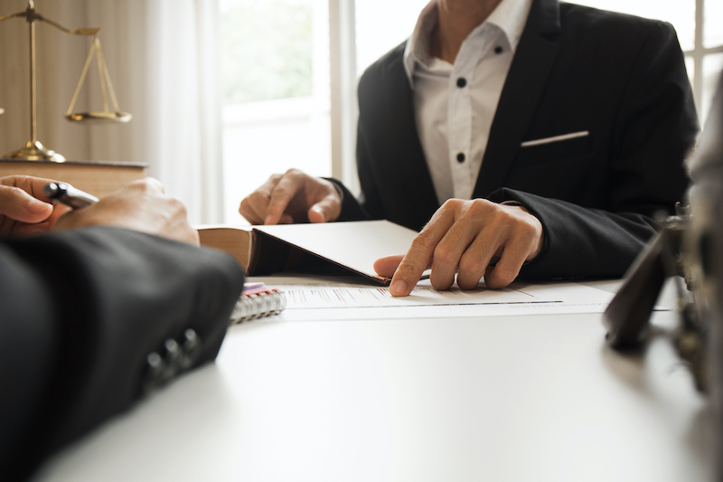 Lawyer Pointing at Document
