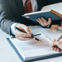 laweyer-with-documents Lawyer With Document And Pen