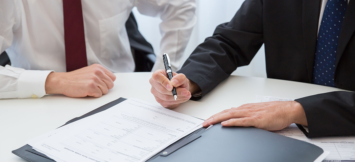 Estate Planning Attorney and Client Reviewing Paperwork